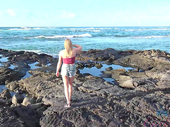 Natural blonde Melody Marks strips down to pose nude on the beach