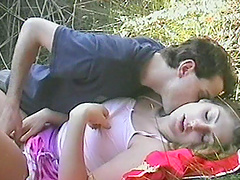 Couple in the grass fools around with oral and hardcore sex