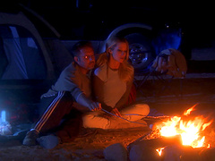 Beautiful blonde fucked in doggystyle by the campfire