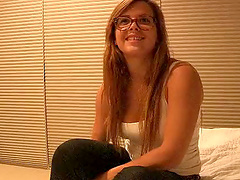 Nerdy girl in a tight tank top leaves lots of cleavage to ogle