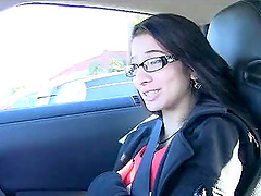 Slim brunette with glasses poses naked in car and at home