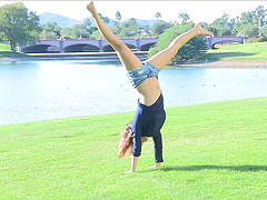 This short-haired cutie strips down to her denim shorts in the park