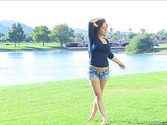 This short-haired cutie strips down to her denim shorts in the park