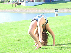 This short-haired cutie strips down to her denim shorts in the park