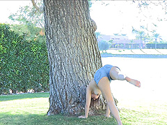 This short-haired cutie strips down to her denim shorts in the park